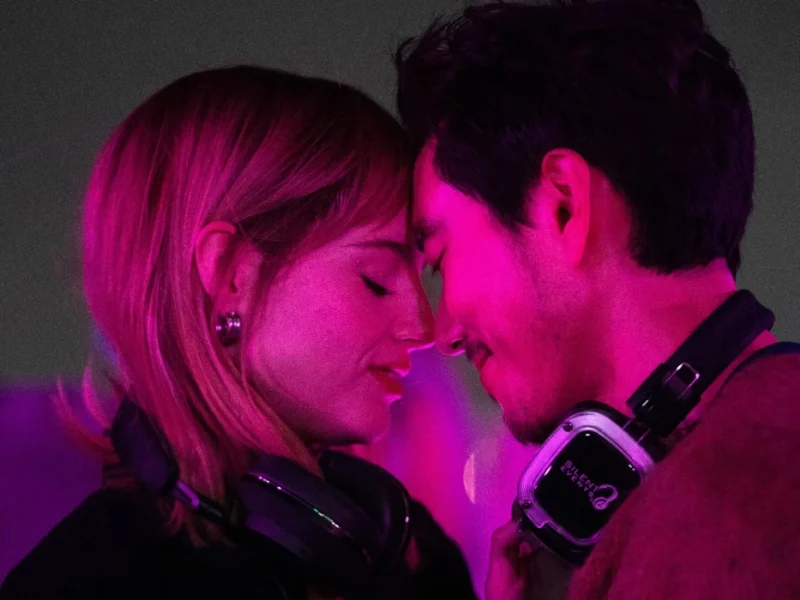 the greatest hits a melodic journey through time on star the greatest hits movie with lucy boynton and justin h min pressing their heads together in a heart