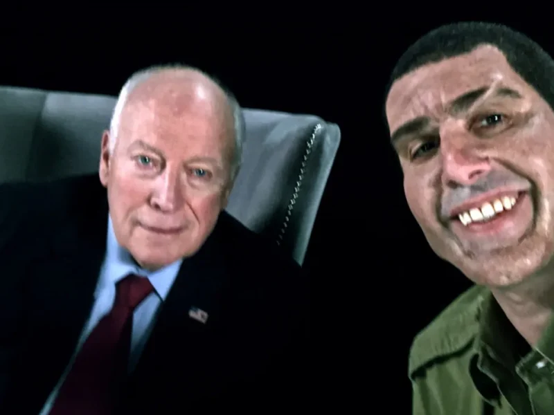 Sacha Baron Cohen, as his character Erran Morad, poses alongside former US Vice President Dick Cheney in a controversial scene from *Who Is America?*, where he gets Cheney to sign a "waterboarding kit."